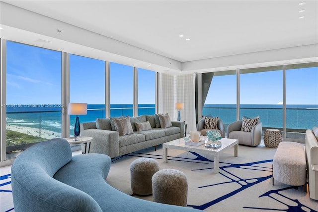 living room with a water view and recessed lighting