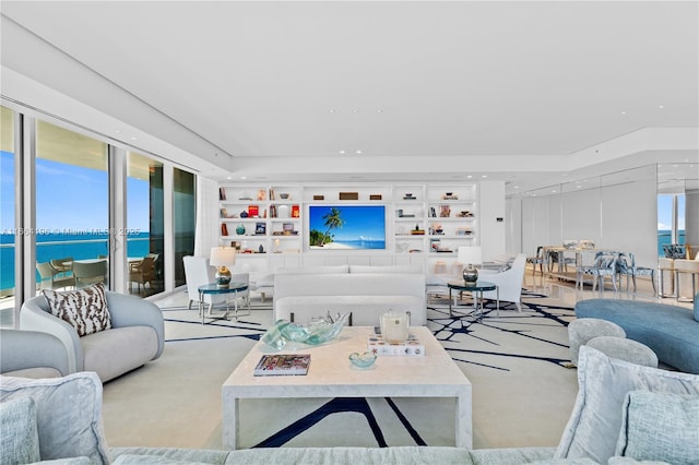 carpeted living area featuring built in features