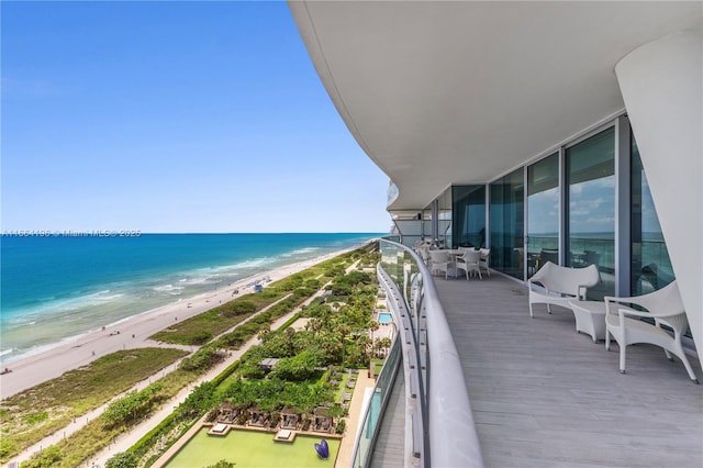 bird's eye view with a view of the beach and a water view