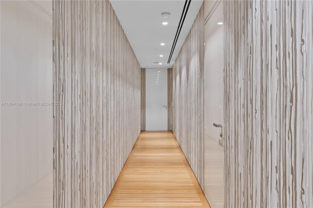 corridor with recessed lighting and wood finished floors