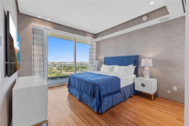 bedroom with wood-type flooring