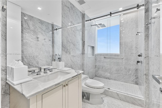 bathroom featuring vanity, a marble finish shower, and toilet