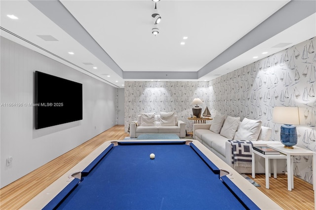 game room with wood finished floors and pool table