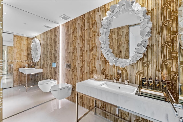 bathroom featuring visible vents, a sink, and toilet