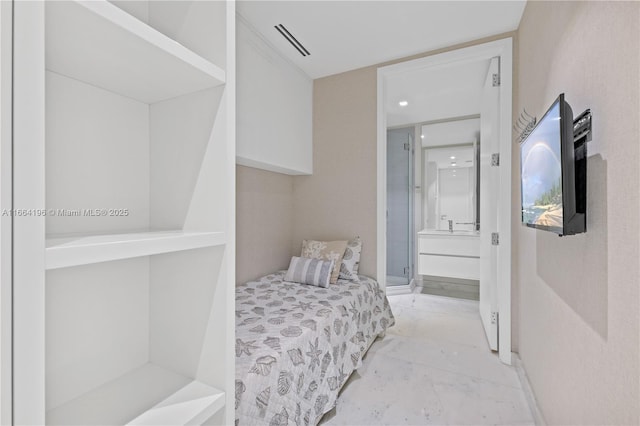 bedroom featuring marble finish floor, ensuite bath, and visible vents