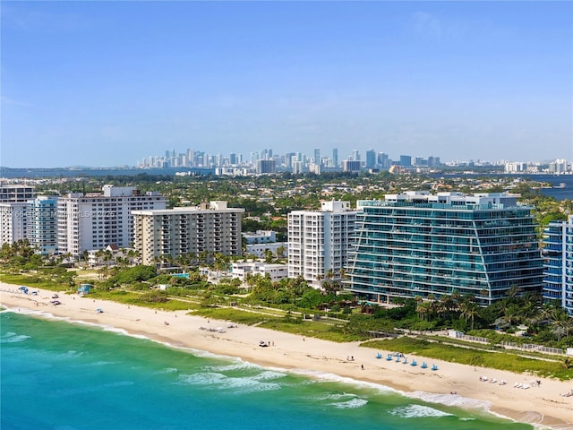 birds eye view of property featuring a view of the beach and a water view