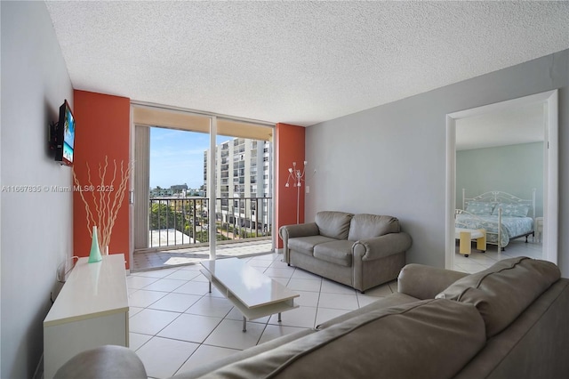 7921 Byron Ave Unit 507, Miami Beach, FL 33141 - living room featuring floor to ceiling windows, light tile patterned floors, and a textured ceiling