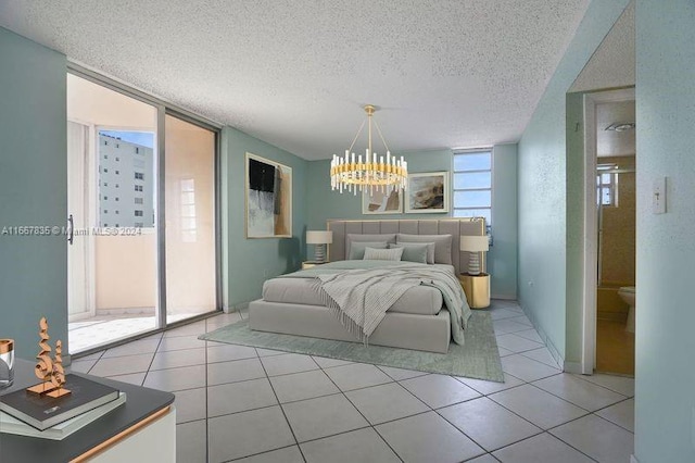 bedroom featuring a wall of windows, a textured ceiling, and light tile patterned floors