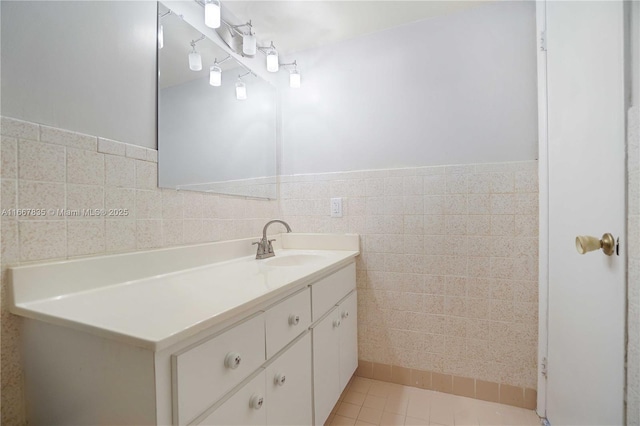 7921 Byron Ave Unit 507, Miami Beach, FL 33141 - bathroom featuring tile patterned flooring, vanity, tile walls, and wainscoting