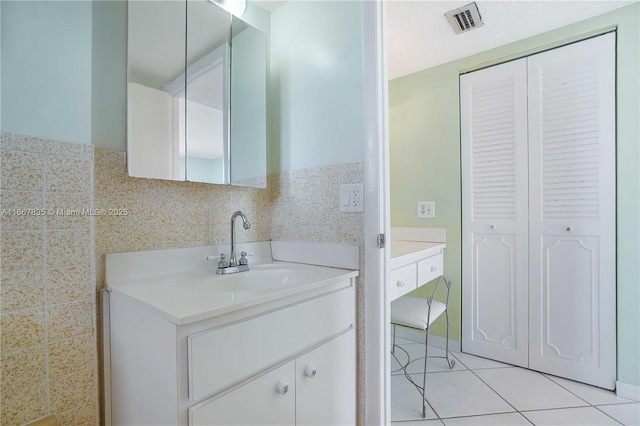 7921 Byron Ave Unit 507, Miami Beach, FL 33141 - bathroom with visible vents, tile patterned floors, and vanity
