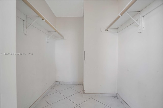 7921 Byron Ave Unit 507, Miami Beach, FL 33141 - walk in closet featuring light tile patterned floors