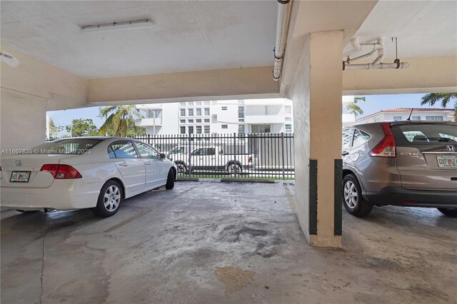 7921 Byron Ave Unit 507, Miami Beach, FL 33141 - view of parking with fence