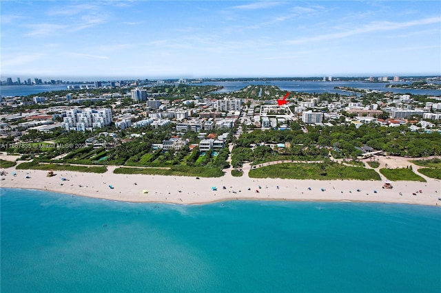 bird's eye view featuring a view of the beach and a water view