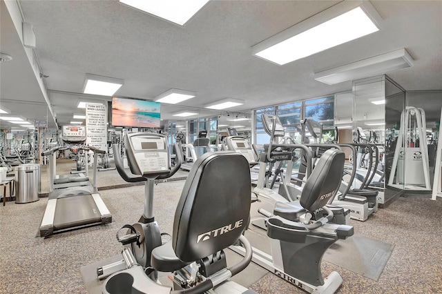 gym featuring a textured ceiling