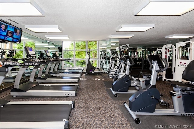 exercise room with a textured ceiling