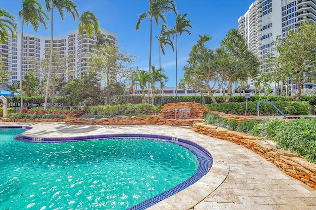 view of pool featuring a patio