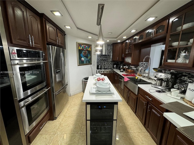 kitchen with decorative backsplash, wine cooler, pendant lighting, stainless steel appliances, and dark brown cabinets