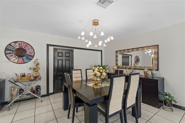 dining room featuring light tile patterned floors and a chandelier