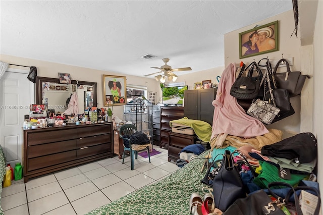 bedroom featuring ceiling fan and light tile patterned flooring