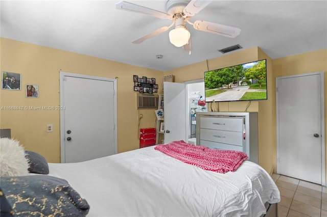 tiled bedroom with ceiling fan