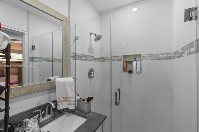 bathroom with vanity and an enclosed shower