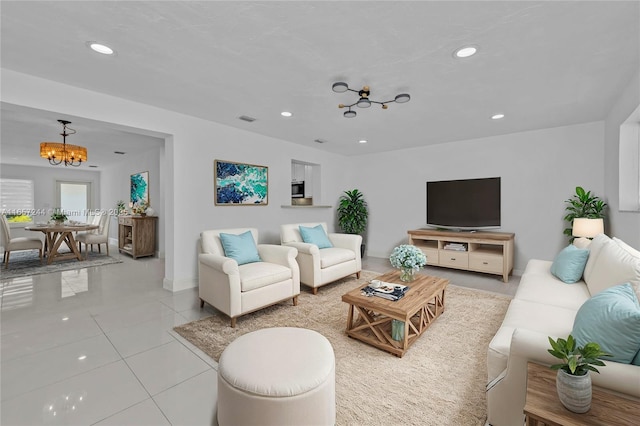 living room featuring a notable chandelier, recessed lighting, visible vents, light tile patterned flooring, and baseboards