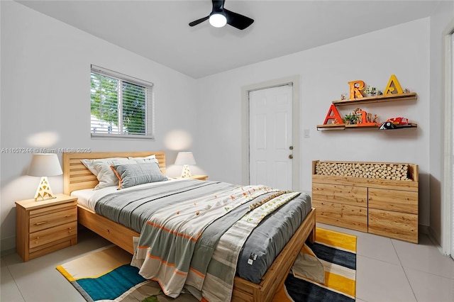 bedroom featuring light tile patterned flooring and ceiling fan