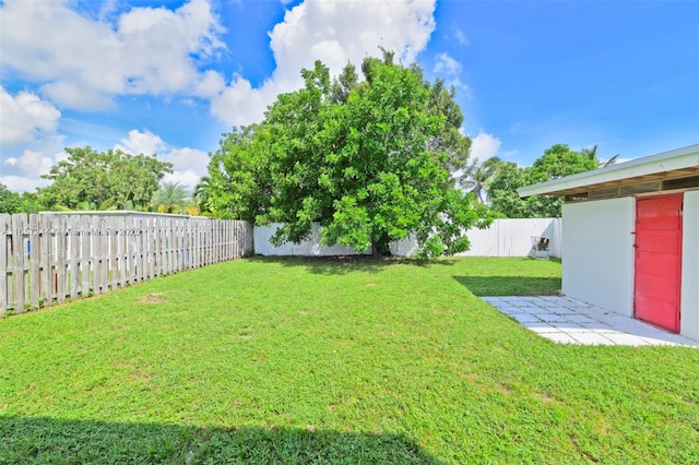 view of yard with a fenced backyard