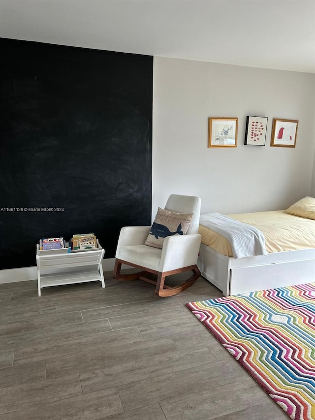 bedroom featuring hardwood / wood-style flooring