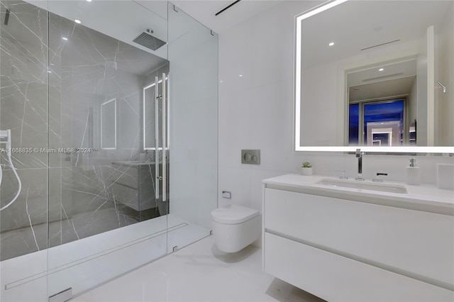 bathroom featuring toilet, a marble finish shower, and vanity