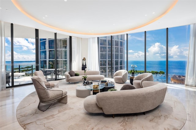 living room featuring expansive windows and a water view