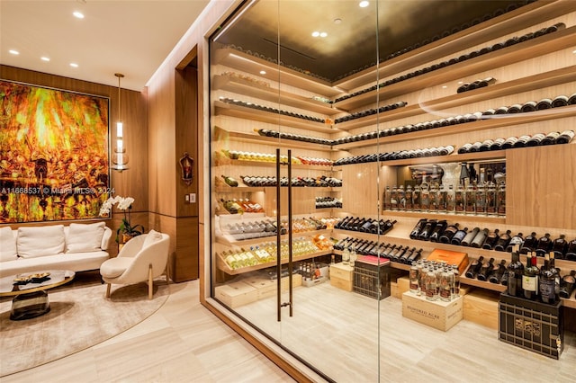 wine cellar featuring wooden walls