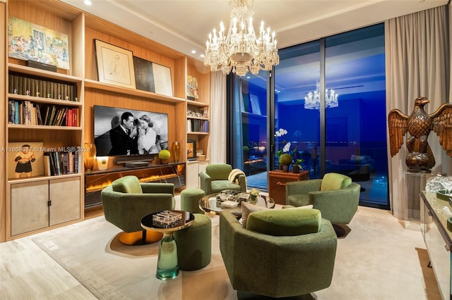 living area featuring light wood-type flooring, built in features, and a chandelier