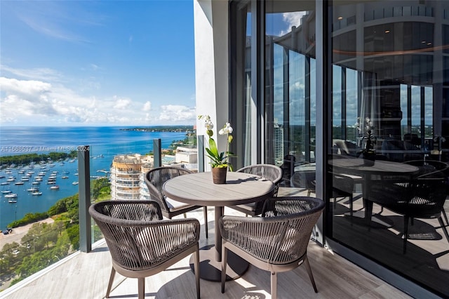 balcony featuring a water view