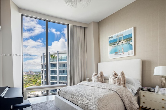 bedroom featuring a wall of windows