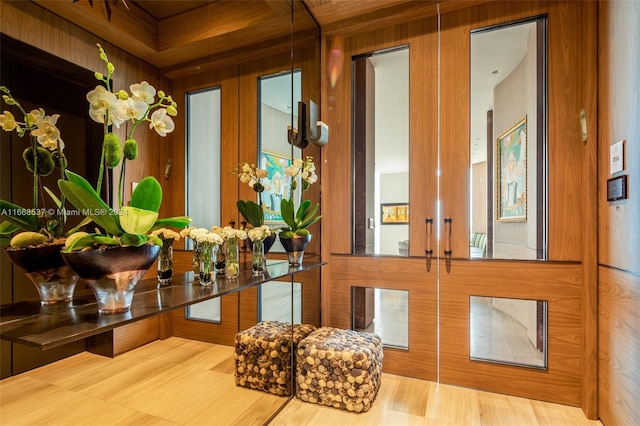 interior details with wood walls and french doors