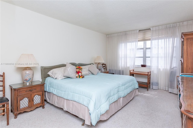 carpeted bedroom with a textured ceiling