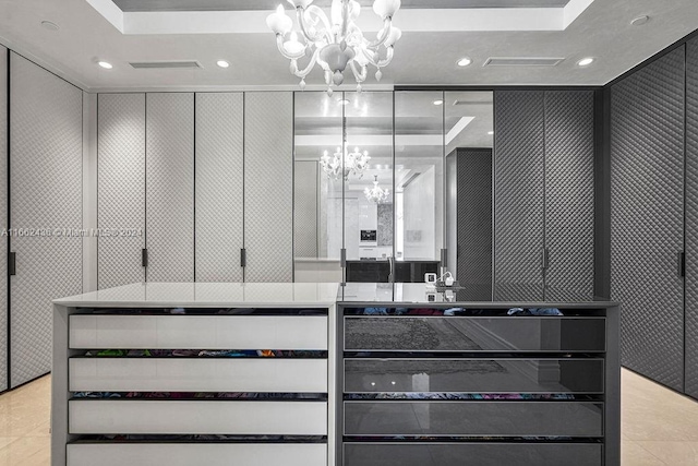 interior space with a chandelier and tile patterned floors