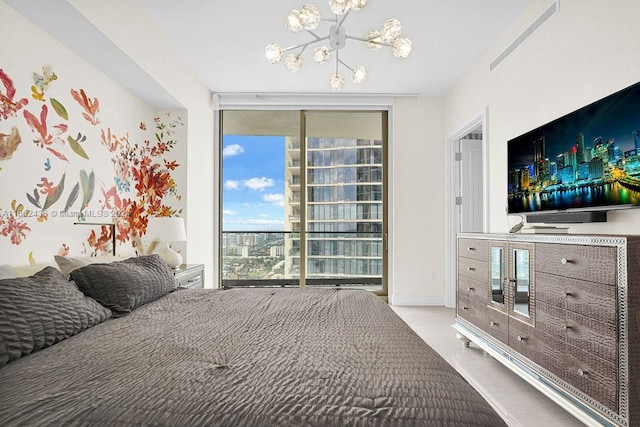 bedroom featuring a notable chandelier and expansive windows