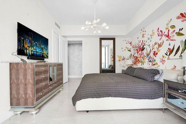 bedroom featuring an inviting chandelier