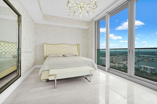 bedroom with expansive windows, an inviting chandelier, and access to exterior