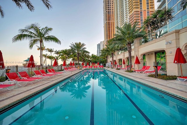 view of pool at dusk