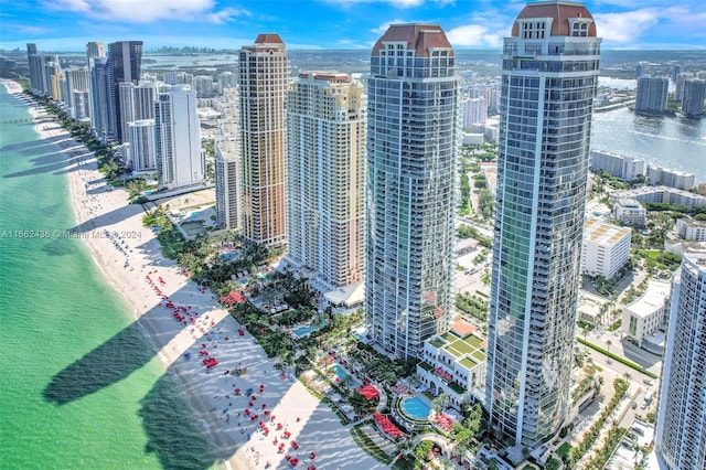 exterior space with a water view and a view of the beach