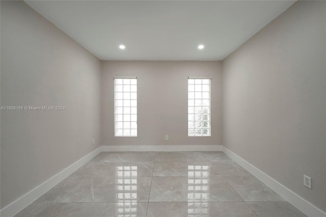 spare room with light tile patterned flooring