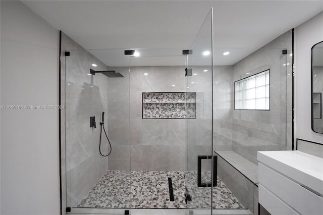 bathroom with vanity and an enclosed shower