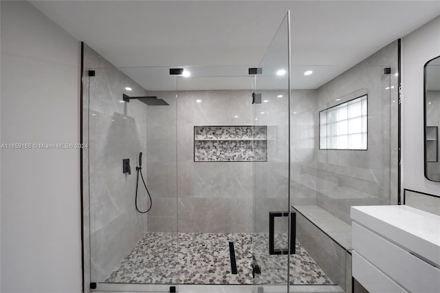 bathroom with vanity, recessed lighting, and a stall shower