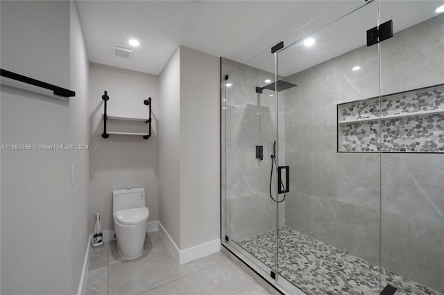 bathroom with walk in shower, tile patterned flooring, and toilet