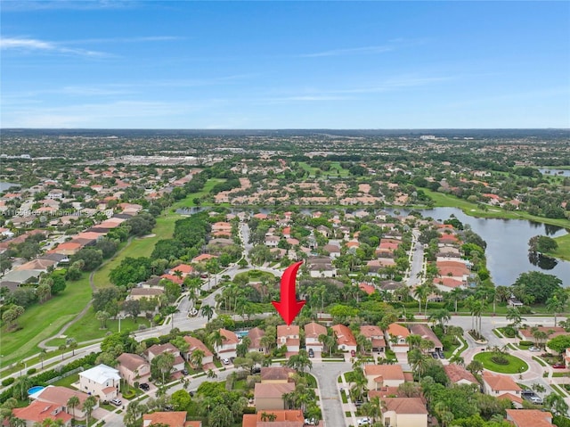 bird's eye view featuring a water view and a residential view