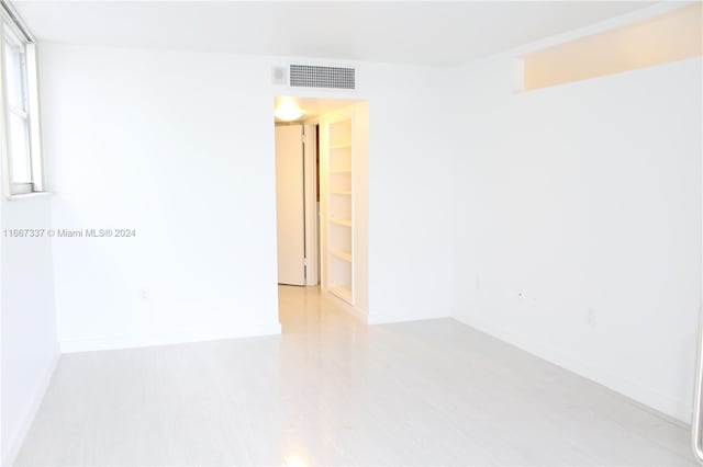 empty room with light wood-type flooring