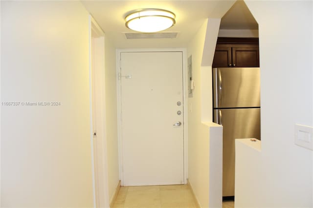 corridor with light tile patterned floors